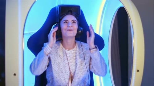 Woman Enjoys Virtual Reality Experience in Futuristic Setting