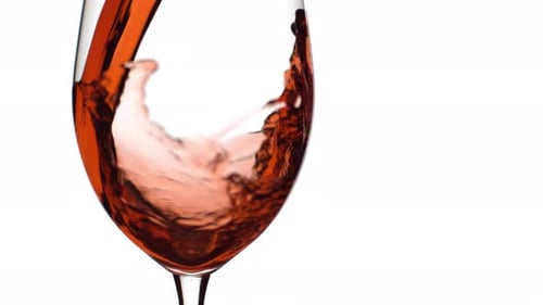 Slow motion shot of red wine pouring into glass on white background; shot on Phantom Flex 4K at 1000