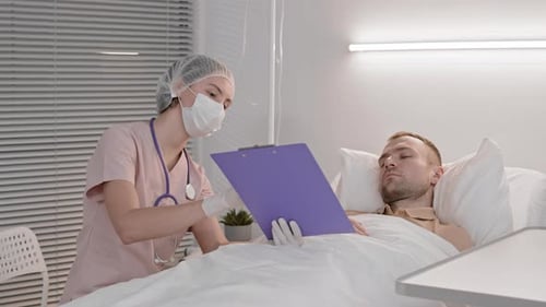 Sick Patient Signing Medical Papers