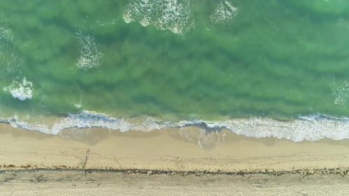 Sea with Waves and Sandy Beach in Sunny Morning