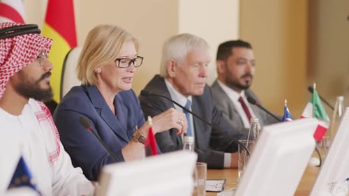 Group of People at a Conference Table Talking