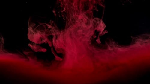 Elegant Red Ink Flowing Through Dark Water