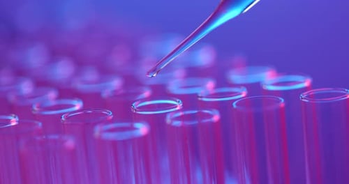 Liquid Being Dispensed Into Test Tubes in Lab