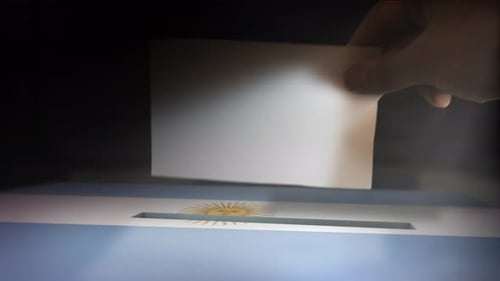 Animated Hand Casting Vote into Argentina Election Ballot Box
