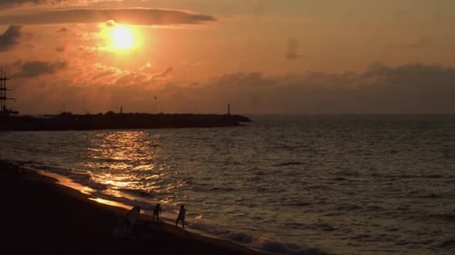 Red sun and seascape at sunset.