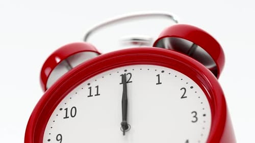 Classic alarm clock alarming at 12 o'clock.