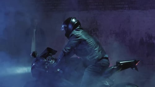 Woman on Motorcycle in Dramatic Urban Setting