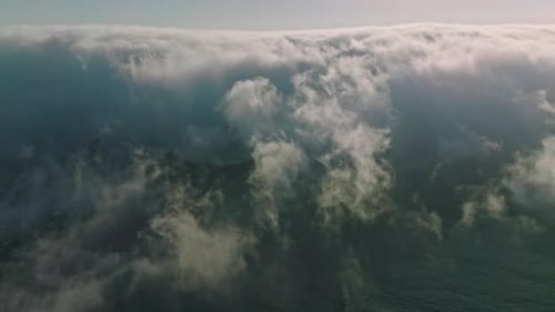 Floating clouds in the blue sky, view from drone