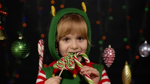 Festive Child Enjoying Christmas Candies