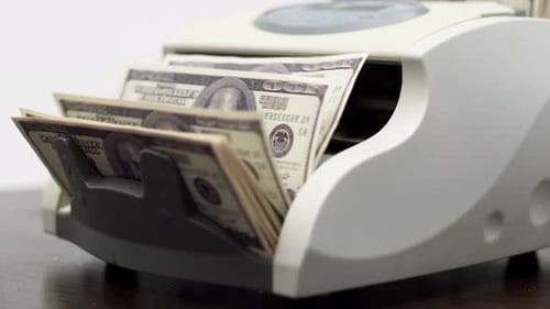 Money Counting Machine Counts US Hundred Dollar Bills