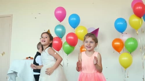 Little Boys and Girls Dance Catching Glitter at Birthday