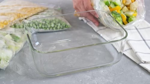 Adding Frozen Vegetables to Glass Baking Dish