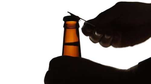 Opening Dark Brown Bottle with a Metal Opener