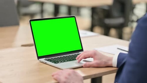 Laptop with Green Screen in the Office