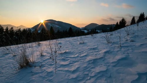 Mountains at Sunset in a Winter Landscape Time Lapse