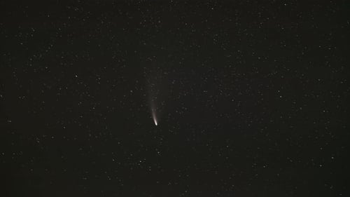 Spectacular Comet Streaks Through Starry Night Sky