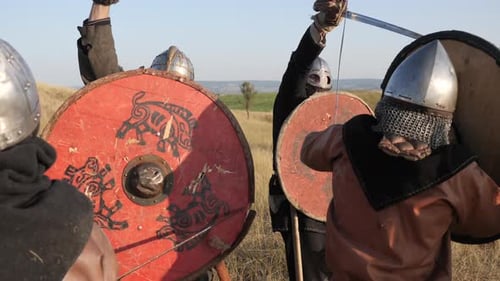 Men in Medieval Armor Fighting on Hill