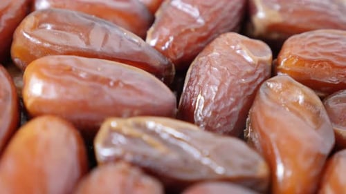 Tasty exotic palm dates fruit packed n the original package 4K 2160p 30fps UltraHD tilting footage
