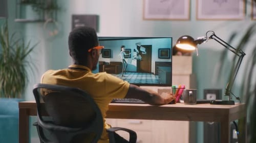 Adult Using Computer to View Cartoon Animation