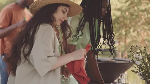 Friends Prepare Summer Meal in Outdoor Setting