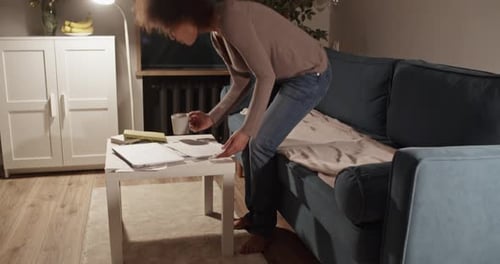 Woman Working on Laptop Late at Night at Home