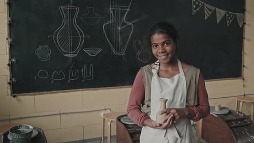 Black Girl Posing with Clay Vase