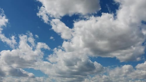 Clouds Drifting Across a Blue Sky