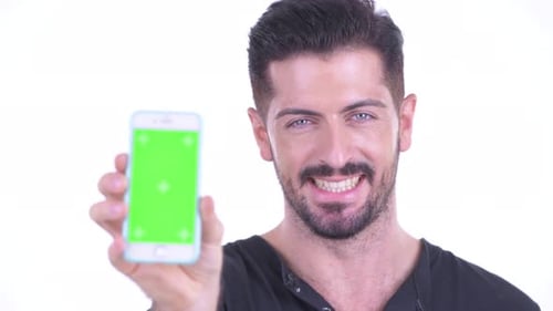 Man Smiling Holding Phone with Chroma Key Screen