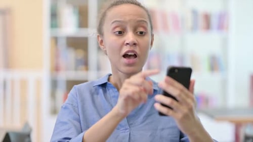 Woman Receives Good News on Smartphone