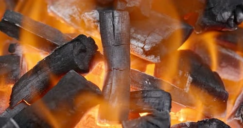 Burning Charcoal Close Up with Flames