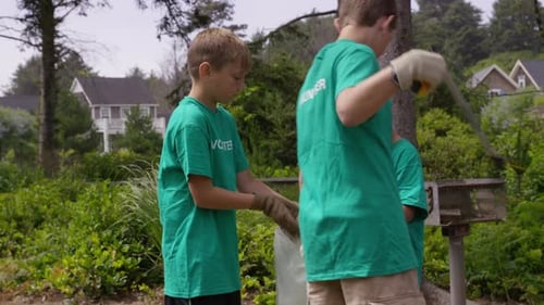 Group of volunteers cleaning up park