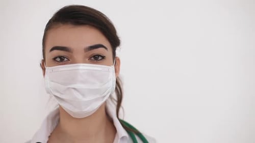 Woman Wearing Mask in Medical Setting Close Up