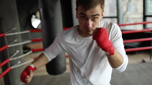 Young Man Boxing in the Ring