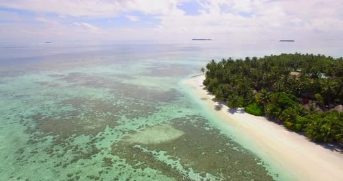 Aerial drone view of a scenic tropical island in the Maldives