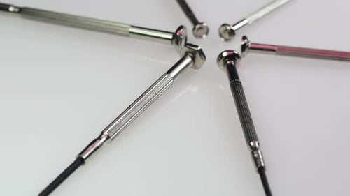Close Up of Silver Screwdrivers in Star Pattern