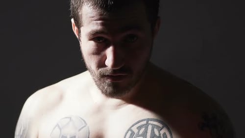 Intense Close-Up of Tattooed Man