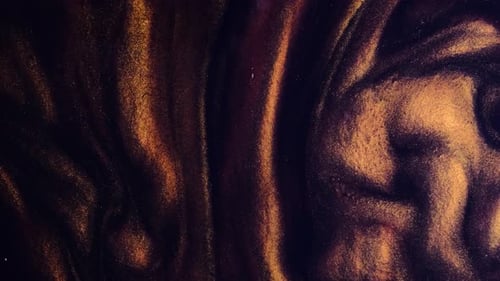 Abstract Flowing Golden Metallic Particles on Dark Backdrop