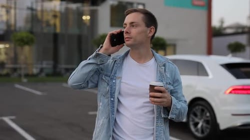 Man Calling By Smartphone in City