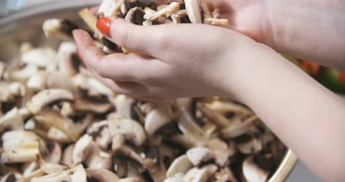 Preparing Sliced Mushrooms in the Kitchen