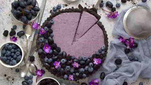 Sweet and Tasty Tart with Fresh Blueberries, Blackberries and Grapes, Served on Stone Background