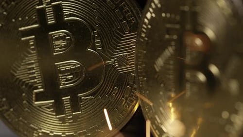 Cryptocurrency on the block chain - close up of bitcoin altcoin physical coins in dynamic setting