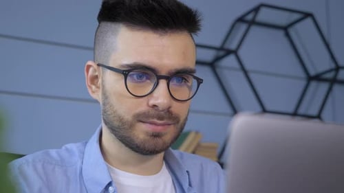 Close Up of Man Using Laptop Indoors