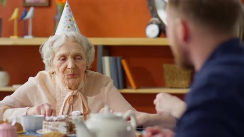 Family Celebrates Birthday at Home With Cake