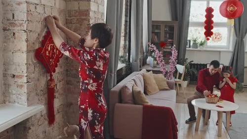 Family Decorating Home for Chinese New Year