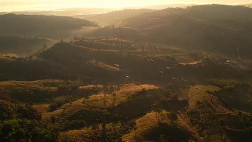 4K Morning mist over a rural village in the high mountains.