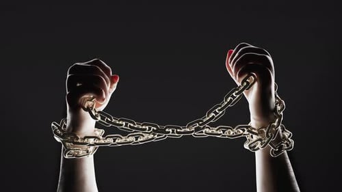 Hands breaking chains. Metal or steel chain is blown to pieces. Break free.