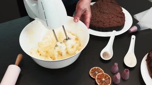 Person Mixing Cream For Cake Baking