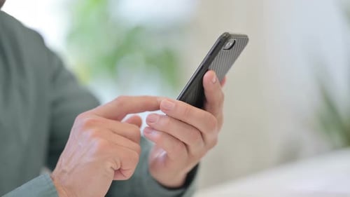 Close Up Of A Person Using Their Phone