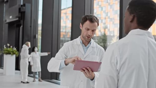 Scientists Working in Modern Hospital