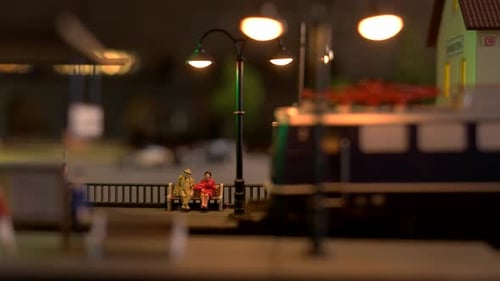 Toy Diesel Locomotive Leaving the Station.